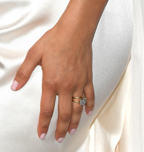 Zendaya wears a milky pink nail color on short nails.